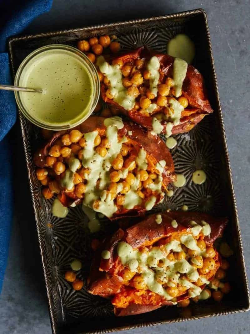 Roasted Chickpea Stuffed Sweet Potatoes with Cilantro-Garlic Cashew Sauce